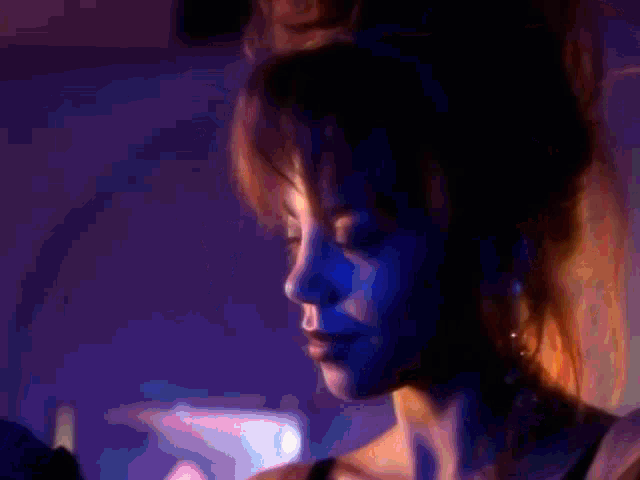 a man and a woman dancing in a club