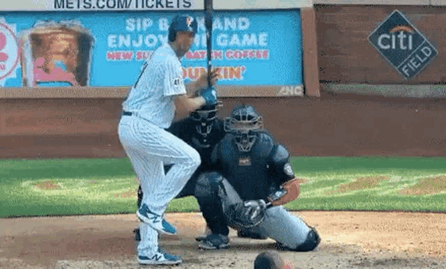 a baseball player with the number 41 on his jersey is swinging at a pitch .