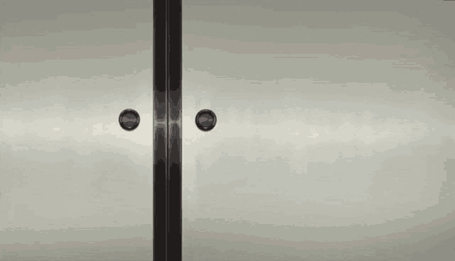 a girl with pink pigtails is standing in a doorway