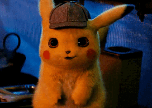 a stuffed pikachu wearing a detective hat is looking at the camera