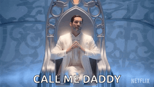 a man in a white suit is sitting on a throne and saying call me daddy