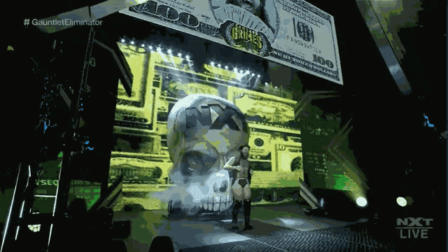 a woman is standing in front of a giant skull and a large 100 dollar bill