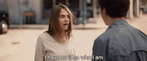 a woman is talking to a man on a street and says `` i have no idea who i am '' .