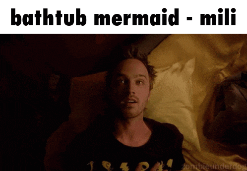 a picture of a man laying in bed with the caption bathtub mermaid mili