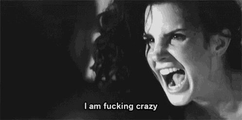 a black and white photo of a woman with her mouth open and the words `` i am fucking crazy '' written below her .