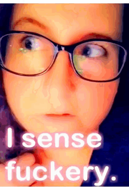 a close up of a person 's face with the words " i sense fuckery " below it