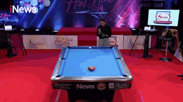 a pool table with the word news on the side