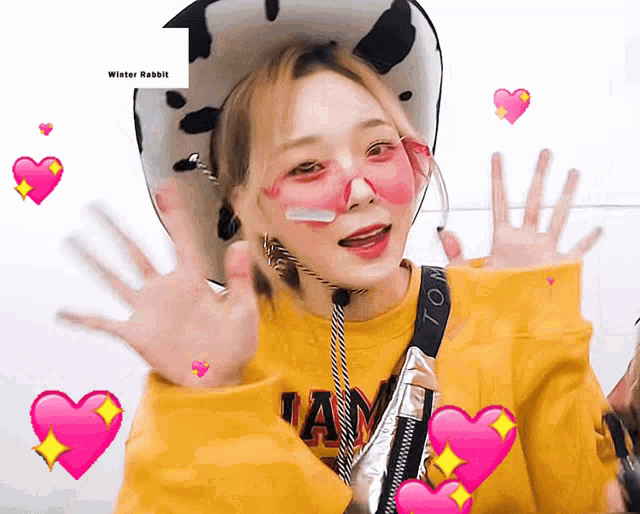 a woman wearing a cow hat and pink sunglasses is surrounded by pink hearts and a logo for winter rabbit