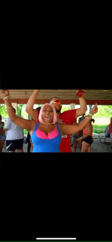 a man and a woman are dancing together in a pavilion .
