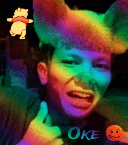 a man with a winnie the pooh filter on his head is giving a thumbs up