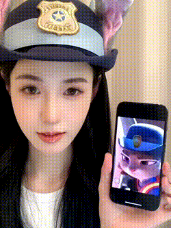 a woman in a police hat is holding a phone