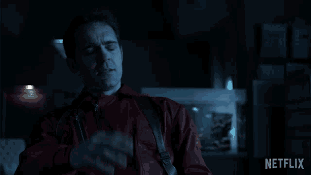 a man in a red jacket with the word sientate written on it