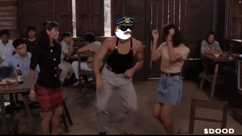 a man in a police hat is dancing with two women in a room with $ dood written on the bottom of the screen