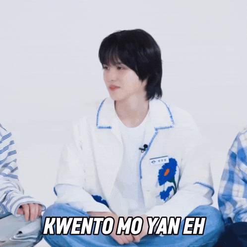 a person sitting on the floor with the words kwento mo yan eh written above them