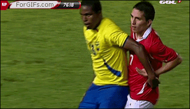 two soccer players on a field with a forgifs.com advertisement