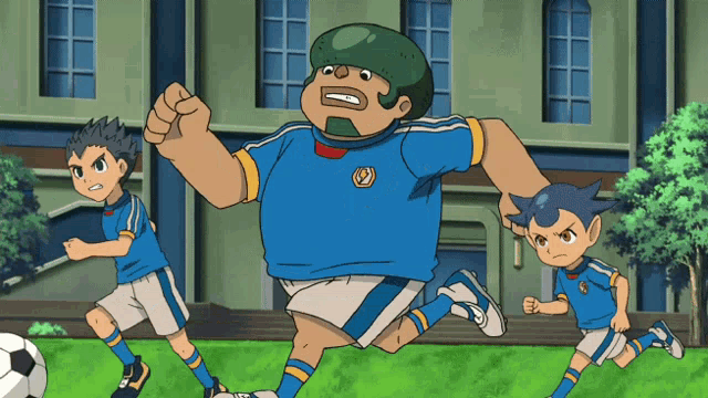 a man in a blue shirt with the letter s on it is running with two other boys