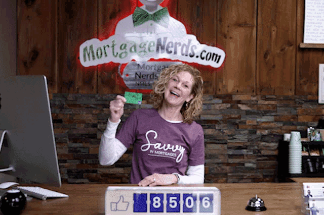 a woman stands in front of a sign that says mortgage nerds