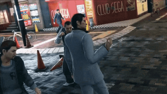 a group of men are walking down a street in front of a club sega sign