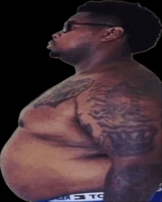 a man with a tattoo on his chest is wearing a pair of underwear that says tc