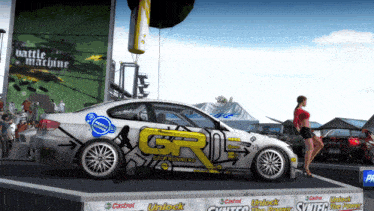 a white car with a yellow g on the side