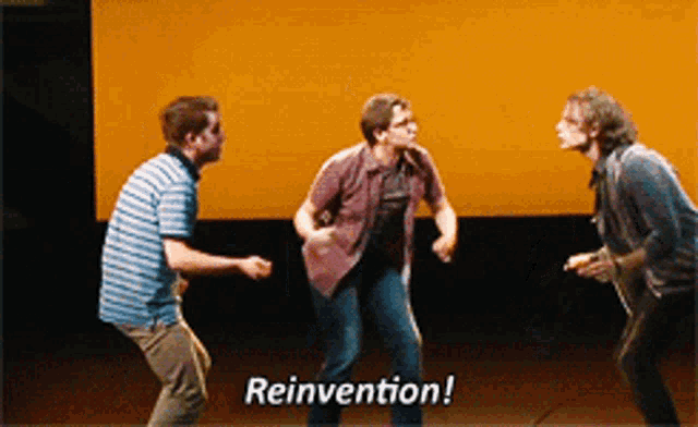 three men are dancing on a stage and the words reinvention are visible