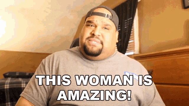 a man says this woman is amazing while wearing a hat