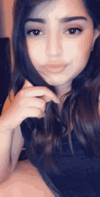 a close up of a woman 's face and hair
