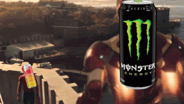 a can of monster energy sits in front of a man