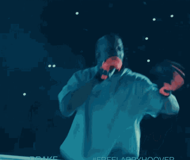 a man in a blue shirt has the word drake on the bottom