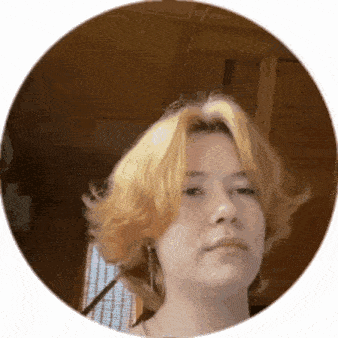 a young girl with blonde hair is taking a selfie in a circle .