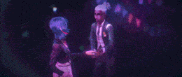 a man and a woman are kissing each other in a dark room .