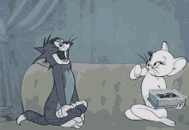 a cartoon of tom and jerry sitting on a couch with jerry holding a box of chocolates