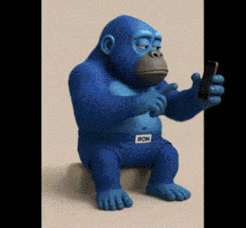 a blue gorilla is sitting on a stool looking at a cell phone