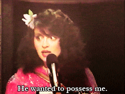 a woman speaking into a microphone with the words he wanted to possess me below her
