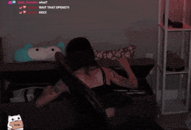 a woman is laying on a couch with the words wait that opens written above her