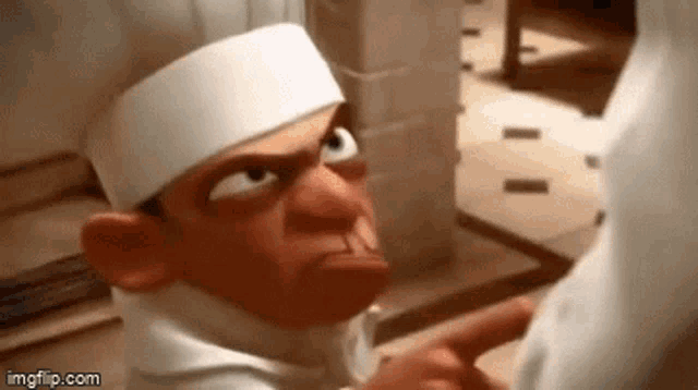 a cartoon chef is pointing at someone in a kitchen .