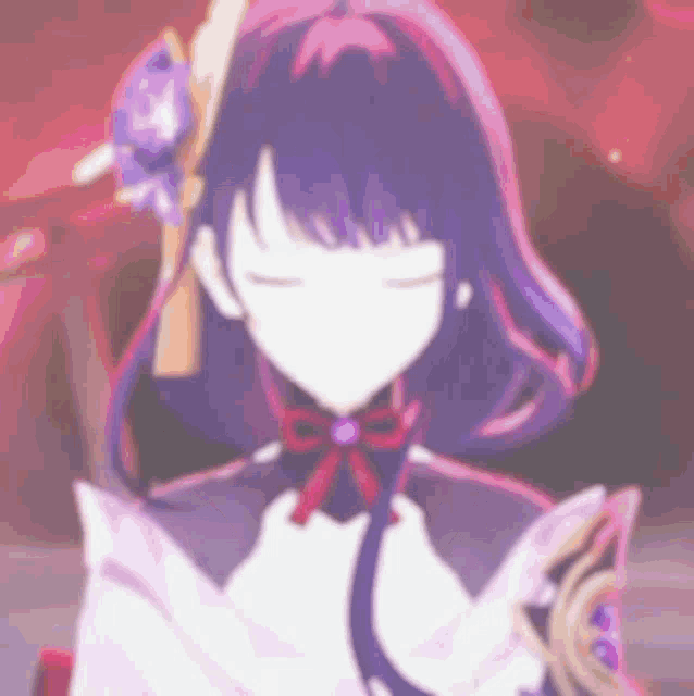 a blurry picture of a girl with purple hair and a red bow on her neck .