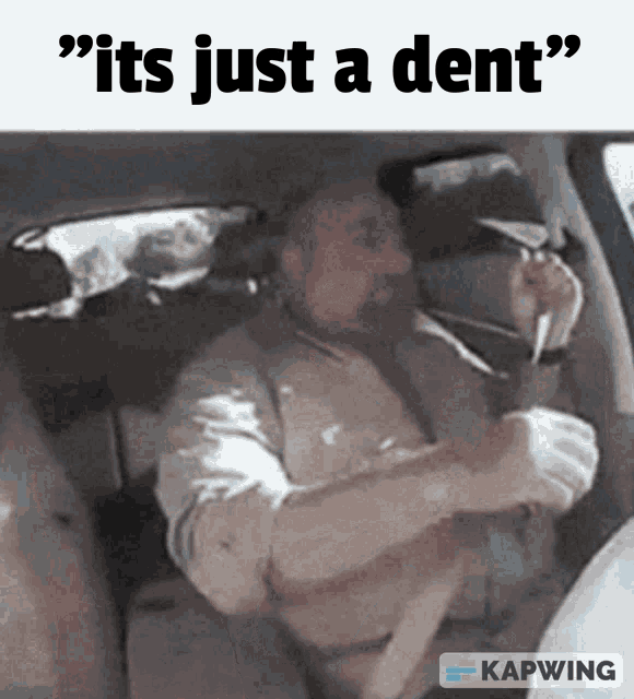 a man in a car with the words " it 's just a dent "