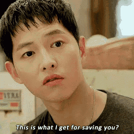 a close up of a man 's face with the words " this is what i get for saving you "