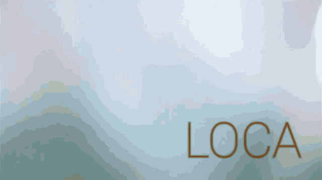 a woman in a bikini is dancing on a beach with the word loca in red letters