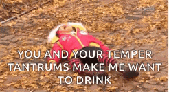 a person in a fireman costume is laying on a pile of leaves with a quote .