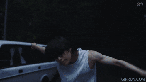 a gif from gifrun.com shows a woman in a blue top