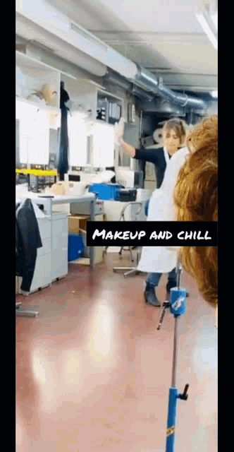 a woman in a white apron is standing in a room with the words makeup and chill below her