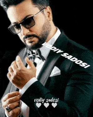 a man in a tuxedo and bow tie has the name vodiy sadosi on the bottom right