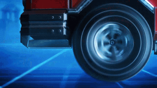 a close up of a wheel of a red truck