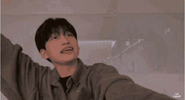 a young man taking a selfie with fat fudge written on the bottom right corner