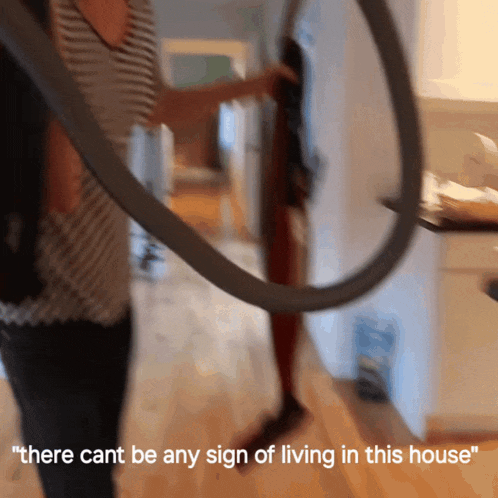 a blurry photo of a person with the words " there cant be any sign of living in this house "