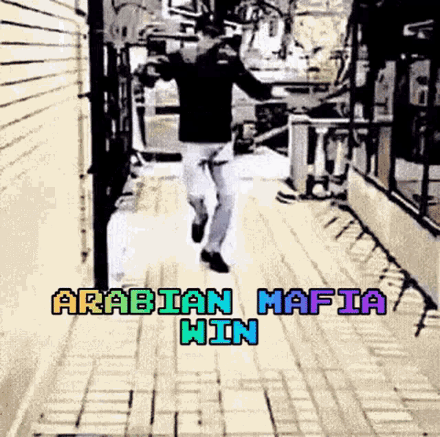 a man is running down a sidewalk with the words " arabian mafia win " on the bottom