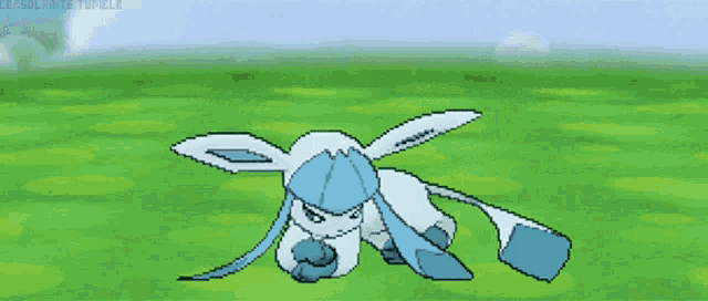 a pixel art drawing of a blue and white rabbit on a grassy field