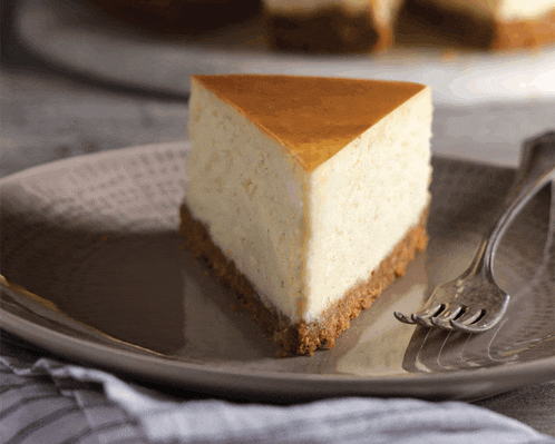 a slice of cheesecake with a fork on a plate